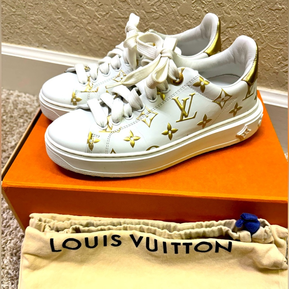 Louis Vuitton while and gold sneakers